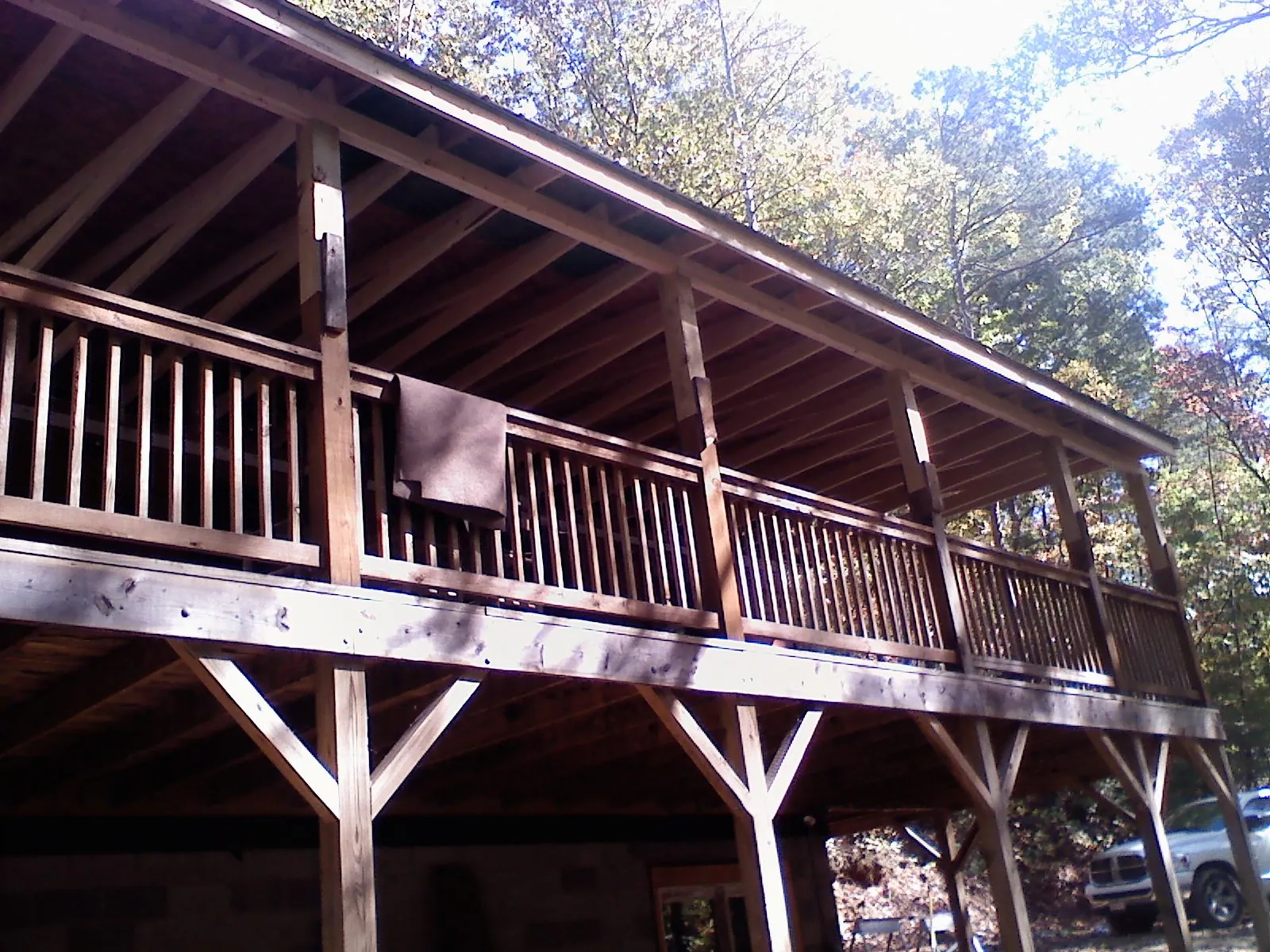 Timber framing under a new elevated porch and deck — Roof Leak Repair in Botkins by Roofing Brothers